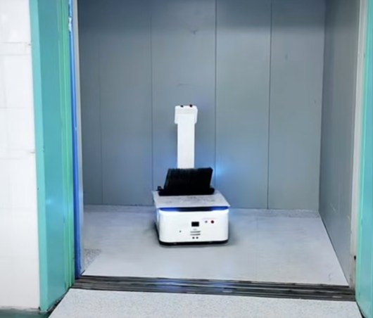 The robot is riding the elevator