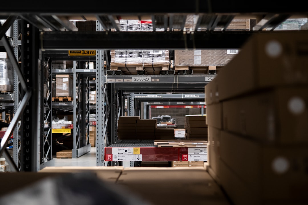 Autonomous forklifts and delivery robots in modern warehouse automation facility